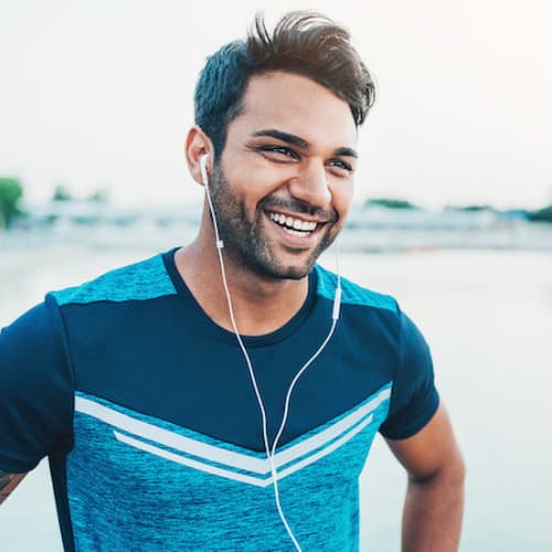 Man on a run smiling about cosmetic bonding in Seattle, WA